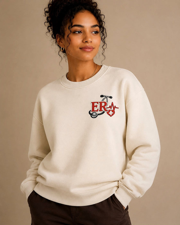 ER Nurse crewneck worn, embroidered chest crest