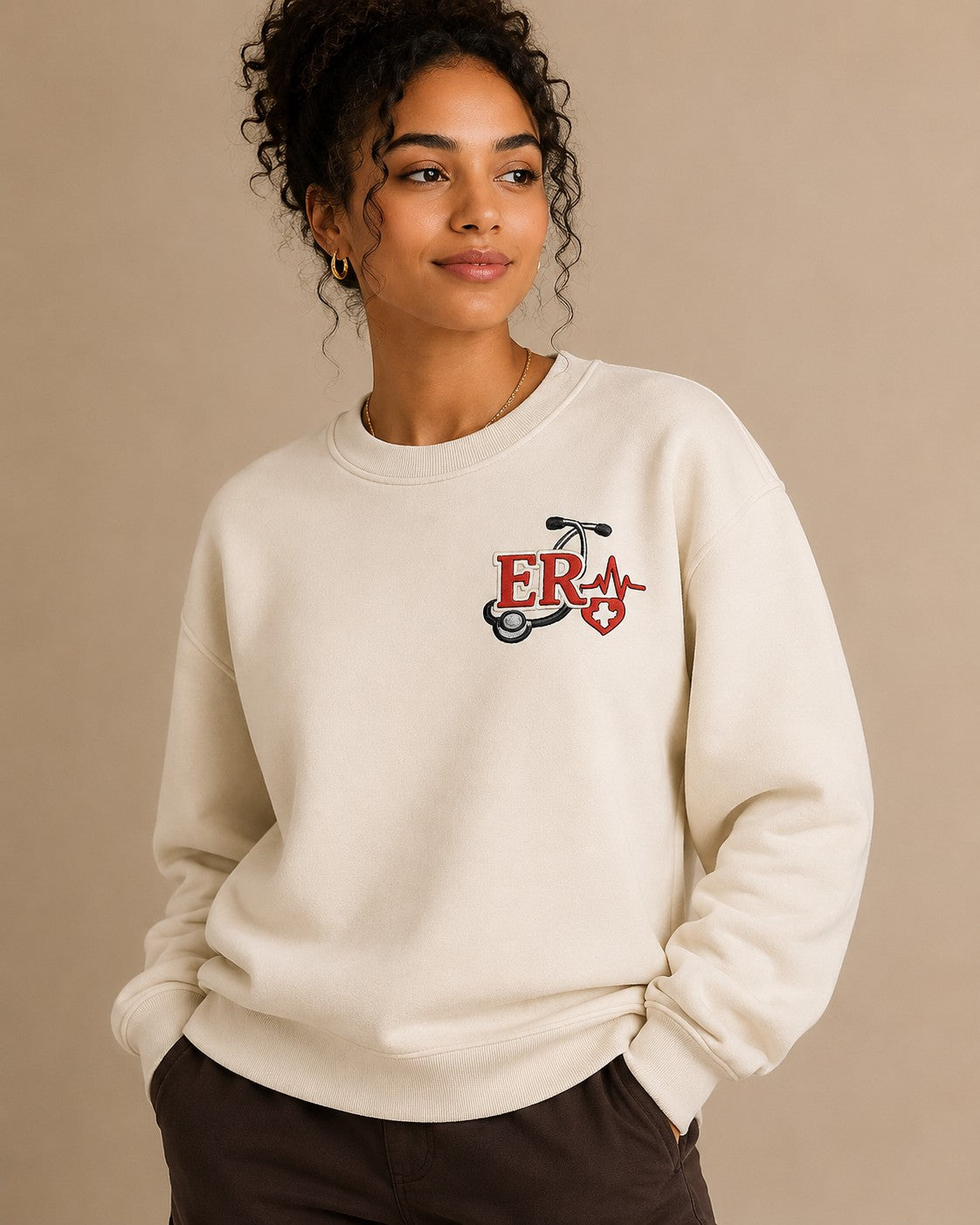 ER Nurse crewneck worn, embroidered chest crest