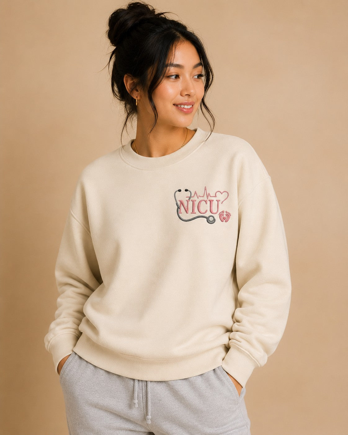 NICU Nurse crewneck worn, embroidered chest design