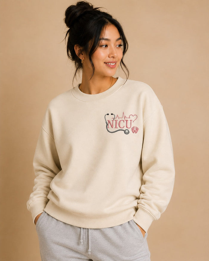 NICU Nurse crewneck worn, embroidered chest design
